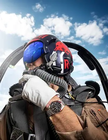 4. Shop All 354 X 456 Pilot wearing a Tudor watch in an aircraft cockpit - Washington Watches