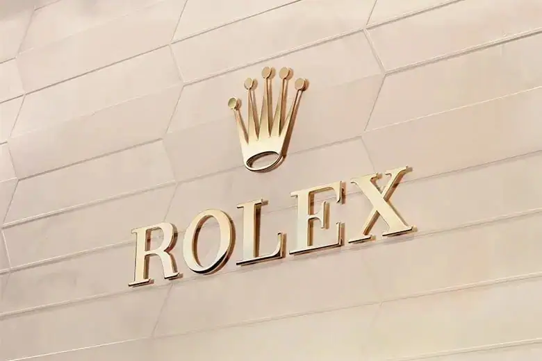 Gold Rolex sign with crown