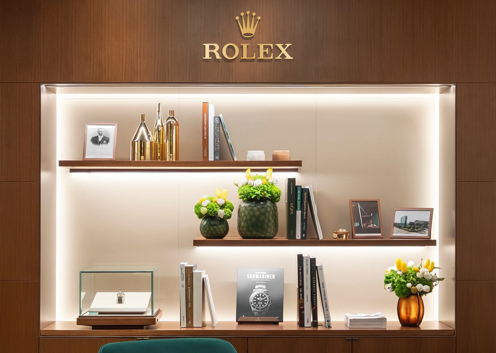 Display cabinet with watch and books